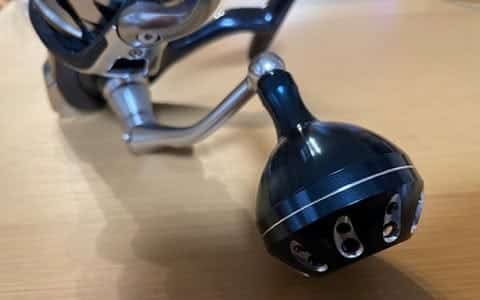 Fishing reel with attached component.