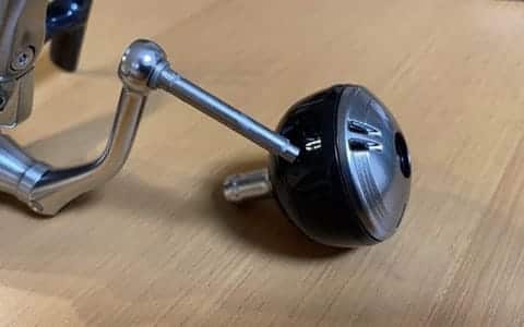Fishing reel part angled on table