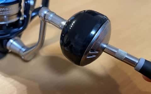 Fishing reel part connected to handle