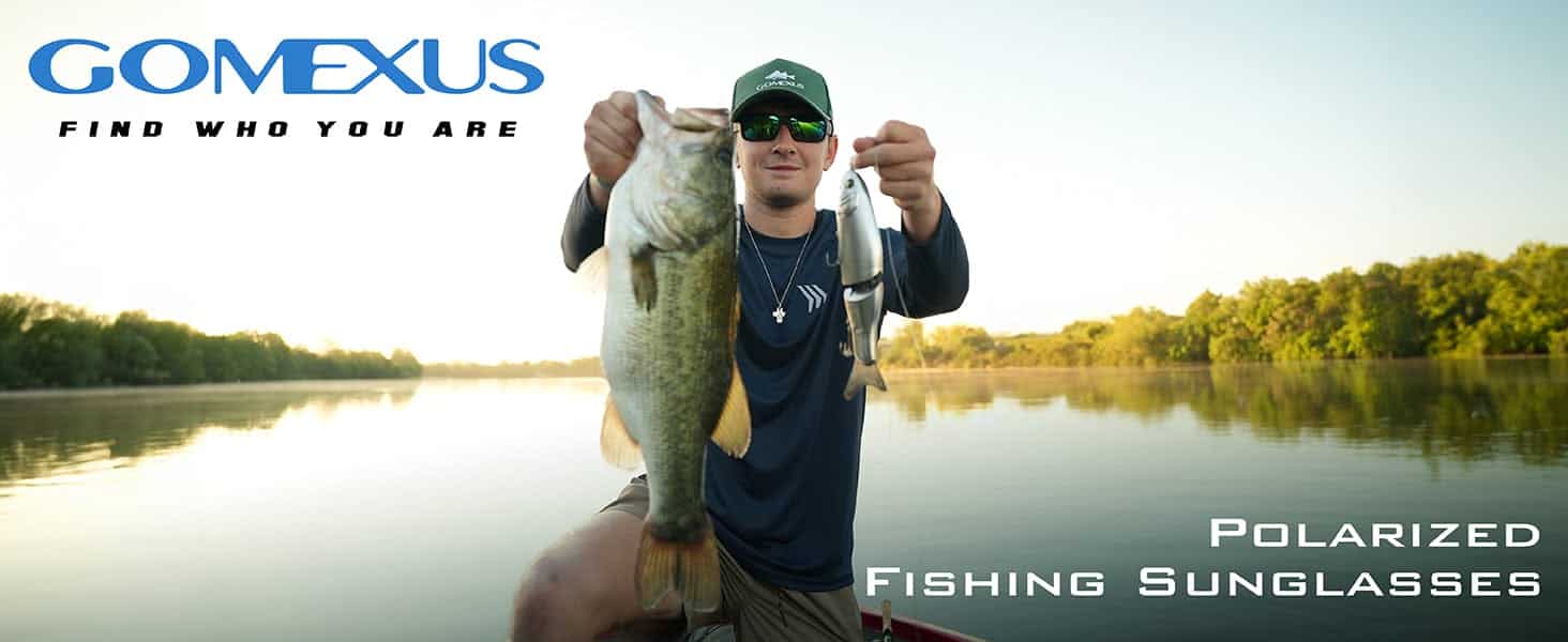 Person holding large fish outdoors.